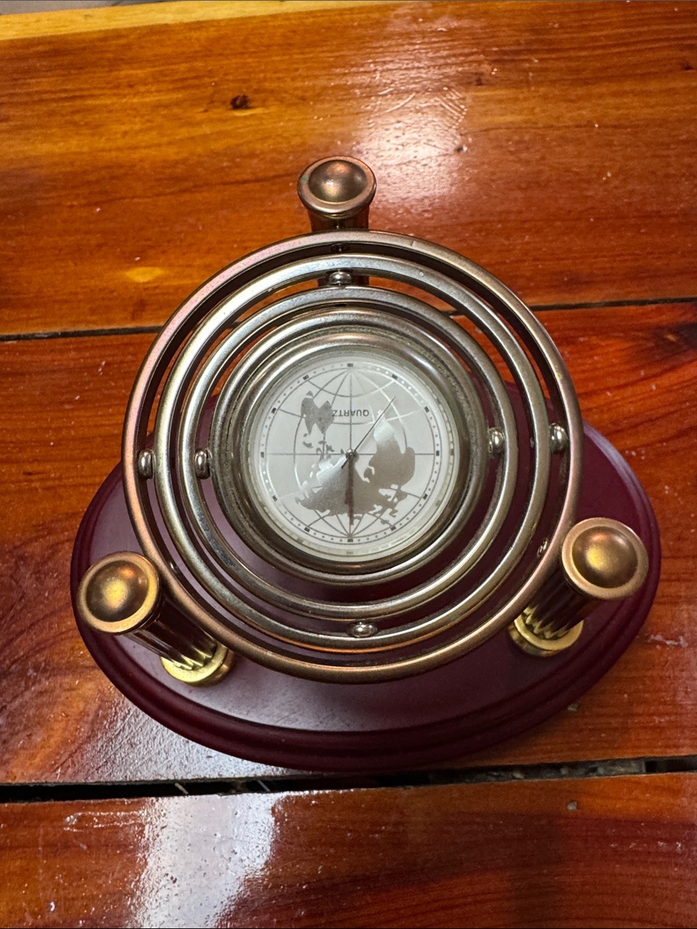 Gyroscopic Desk Clock 2 Toned Metalwork World Map Face. Needs battery